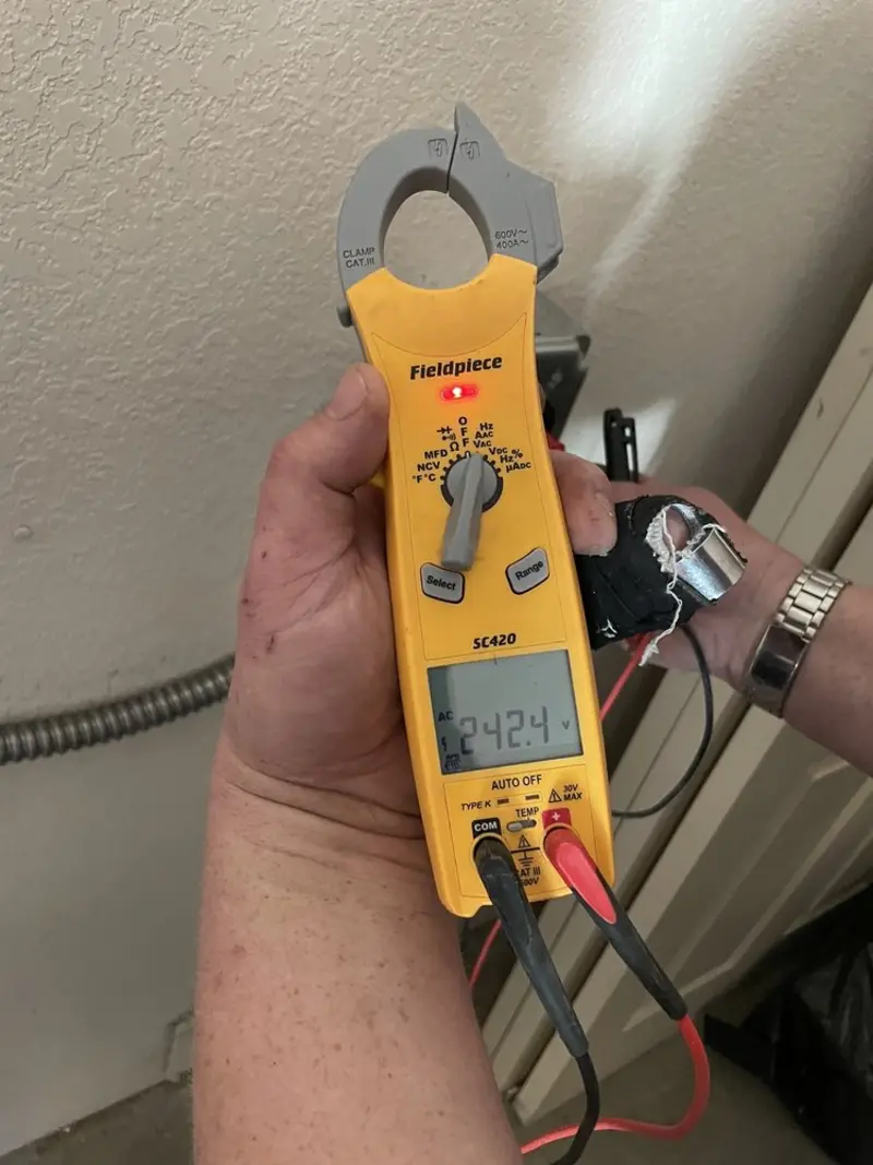 Voltage testing with clamp meter during Circuit Breaker Repair in Tuskegee